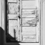 Old doors built into a garden wall.