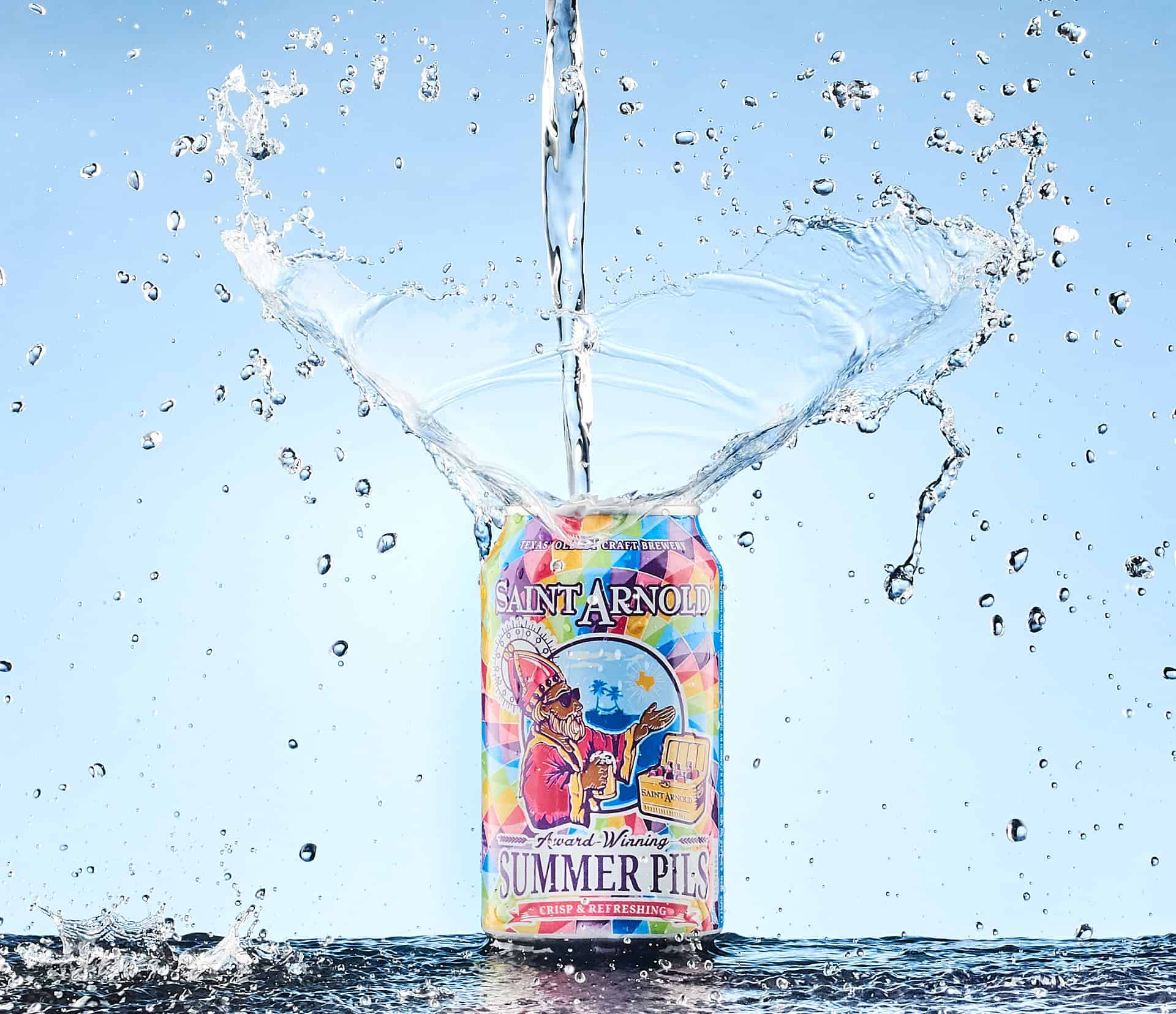 Saint Arnold Beer splashed with water.